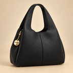 Petit sac souple grainé noir sur fond beige doré